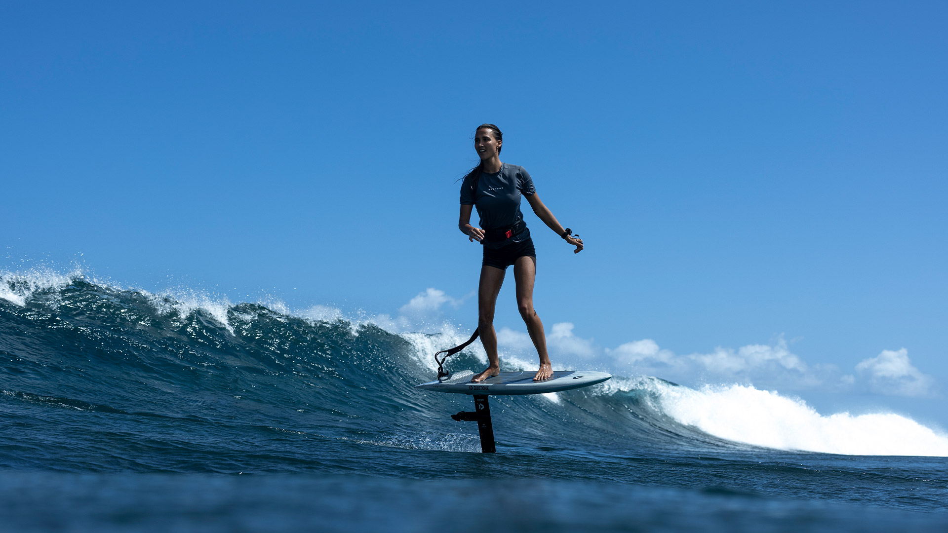 Mo Chauvin surfing on a wave with the Foil Assist